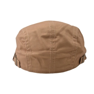 Detail of adjustable metal buckles and stitching on a vintage khaki flat cap