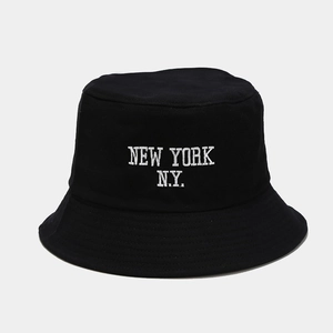 Close-up of New York embroidery on black cotton bucket hat with premium canvas texture