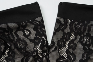 Detail view of black floral lace mesh dress with smooth waistline and hidden zipper closure
