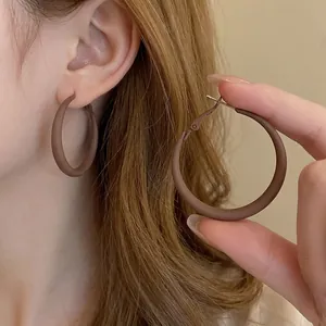 Matte brown minimalist hollow circle hoop earrings in chocolate metal for women