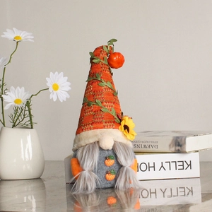 Autumn harvest gnome doll with knitted pumpkin hat and sunflower accents for home decor