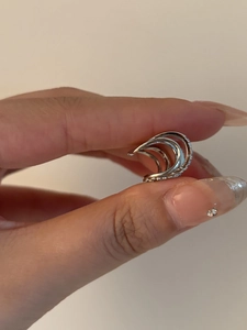 Detailed view of silver multi-layer ear cuff with shimmering micro-paved zircons