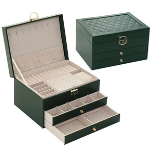 Three-tier dark green leather jewelry organizer box with drawers and soft beige lining