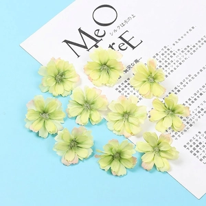 Close-up of artificial plum blossoms in light yellow-green for DIY floral arrangements