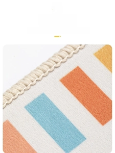 Detail of high-density yarn edging on geometric patterned carpet for nursery rooms
