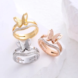 Frosted butterfly rings in gold, silver, and rose gold with zircon inlay on stone base