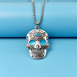 Luminous sugar skull necklace with blue accents and vintage silver floral details