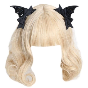 Close-up of black bat wing hair clips on long blonde wavy hair for Gothic Lolita style