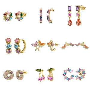 Macro display of nine S925 sterling silver gold earrings with colorful zircon stones