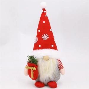 Macro detail of Christmas gnome doll featuring a red snowflake hat and gold silk beard