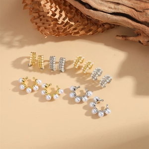 Elegant C-shaped pearl hoop earrings in gold and silver finish with minimalist design