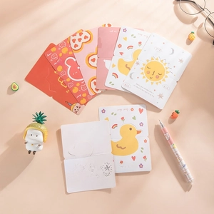 Flat lay of cute cartoon folding greeting cards with bear and duck designs on pink background