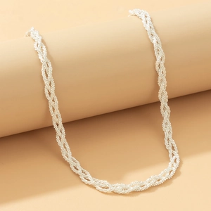 Detail of multi-layered silver twisting rope chain necklace with a woven texture