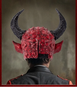 Detailed back view of red devil mask showing textured skin horns and secure black elastic strap