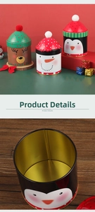 Detailed view of the gold-colored interior and lid of a Christmas tin candy container