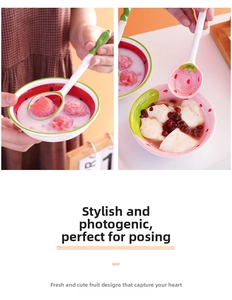 Detail of strawberry and watermelon ceramic bowl set with matching long handle spoons