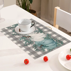Fall Thanksgiving placemat with pumpkin print on grey plaid heat resistant fabric