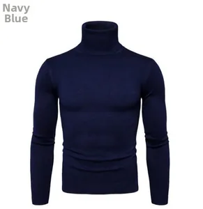 Detail of navy blue turtleneck sweater featuring ribbed knit cuffs and hemline texture