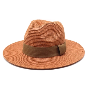 Panama straw hat for women in orange-brown with wide brim and coffee ribbon band