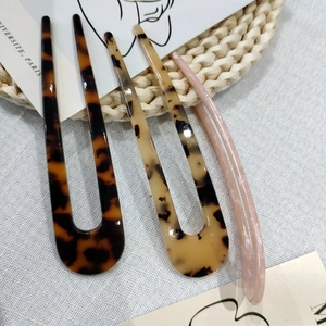 Minimalist U-shaped acetate hair fork pins set in leopard and marble patterns for buns