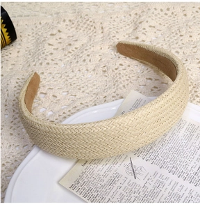 Detail of hand-woven linen headband with V-shaped texture and non-slip lining