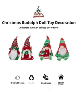 Detail view of handmade Christmas gnomes with red and green knitted hats and white faux fur