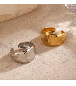 Macro detail of textured 18K gold and silver plated stainless steel adjustable rings