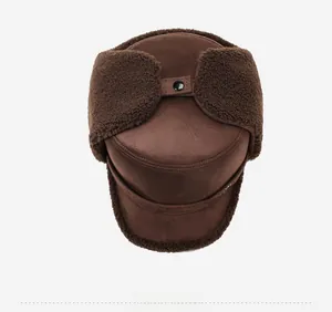 Detail view of winter trapper hat featuring dark brown suede and warm lamb wool lining