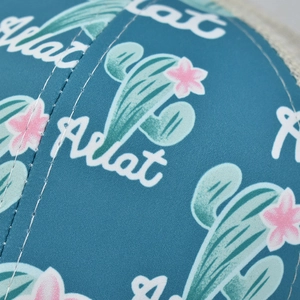 Macro detail of cactus floral print fabric with breathable white mesh and neat stitching