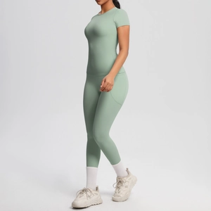 Detail of light green yoga set showing side pocket design and high-waist slimming fit