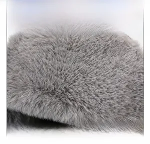 Detailed close-up of soft grey faux fur fabric on the winter thermal trapper hat