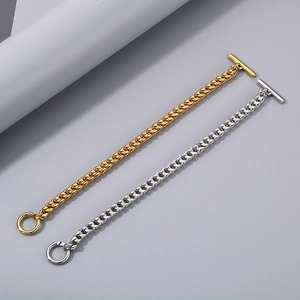 Detail of gold and silver stainless steel dragon bone chains with OT toggle clasp