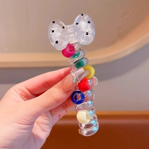 Spiral telephone wire hair tie with colorful beads and black polka dot bow detail