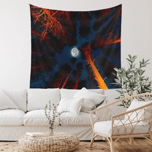 Detail of bohemian forest tapestry with moon and pine trees in a cozy room