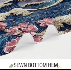 Detail view of the sewn bottom hem on abstract ocean wave and cherry blossom shower curtain