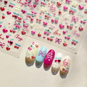 3D nail stickers featuring cherry, heart, and bow patterns with false nail display