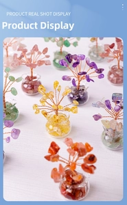 Detail of handcrafted mini crystal trees with colorful natural gemstones and copper wire