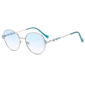 Chic round silver metal frame sunglasses with gradient blue lenses and side gem accents