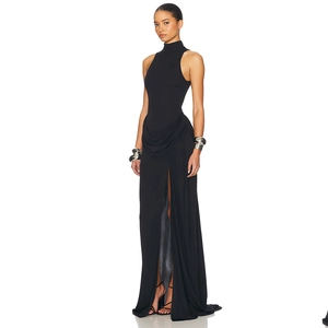 Detail of elegant black sleeveless high neck maxi dress with side slit and waist draping
