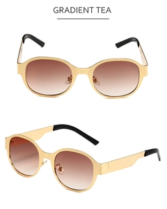 Détails des lunettes de soleil ovales en métal avec verres dégradés thé et monture dorée
