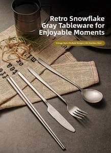 Macro view of vintage snowflake gray stainless steel cutlery set with matte texture