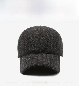 Detailed macro of dark grey textured baseball cap fabric with grey Sport embroidery