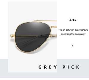 Detail of aviator sunglasses with grey lenses and golden metal frames in Grey Pick color
