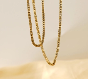 Close-up of 18K gold-plated stainless steel box chain necklace with metallic luster
