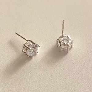 Macro shot of 925 sterling silver stamp on six-claw stud earring with round zircon