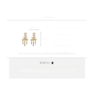 Detail view of silver needle rhinestone spiral star earrings with tassel design