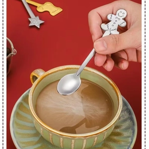 Festive gingerbread man stainless steel spoon used for stirring a holiday drink