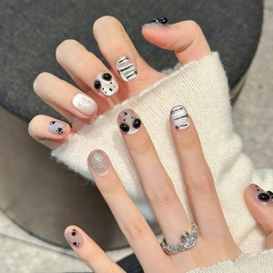 Cute cartoon cat claw press-on nails with 3D bow accents and cat eye silver shimmer finish