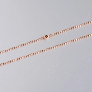 Close-up of rose gold 1.5mm stainless steel bead chain with secure lobster clasp connector