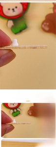 Detail showing 4mm thick transparent acrylic brooch with layered cartoon bear design
